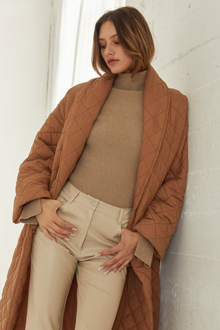 model wearing khaki-colored puffer wrap coat