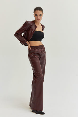 A woman wearing vegan leather pants. 