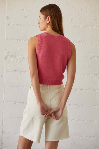 model wearing a pink v-hem crop top